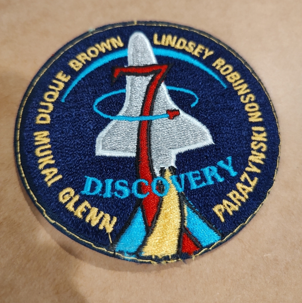 Collectible NASA 4" patch featuring the names of seven astronauts and space